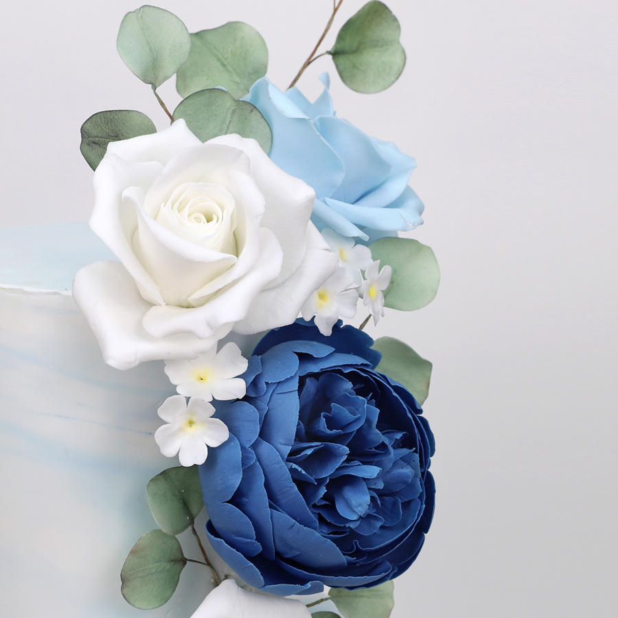 Blue ombre cake with cascading roses