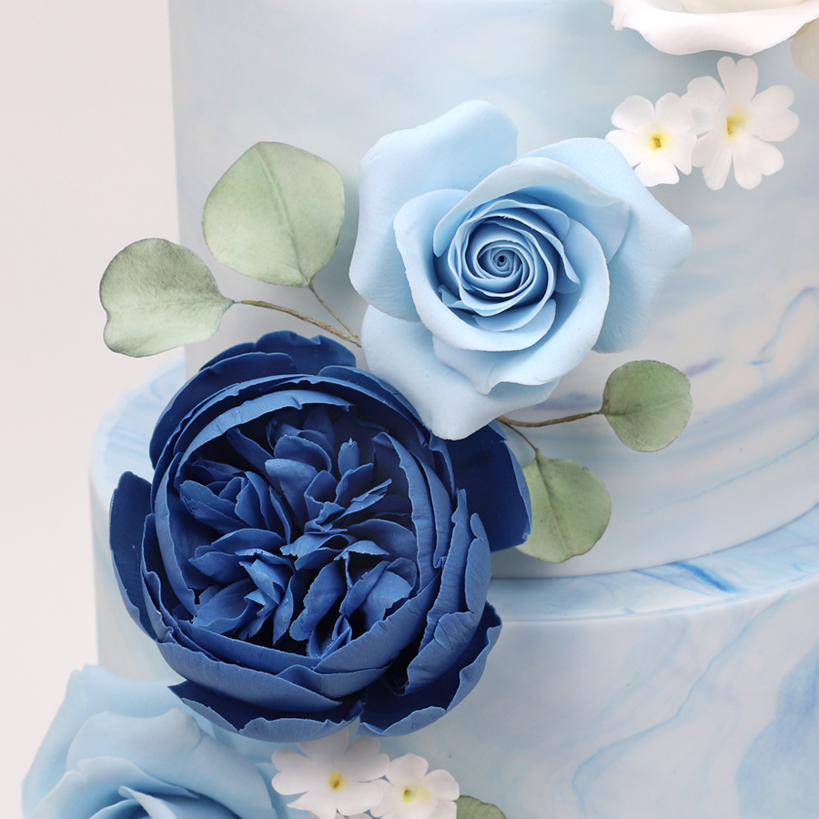 Blue ombre cake with cascading roses