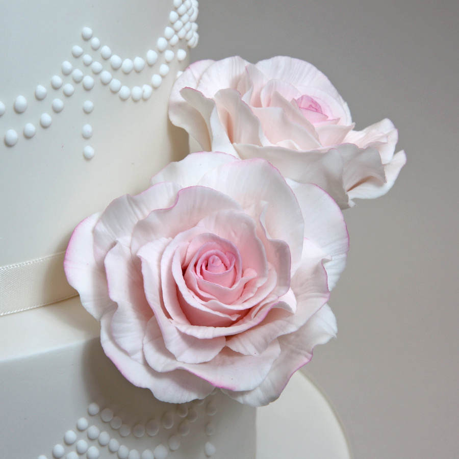 Piped drape cake with roses