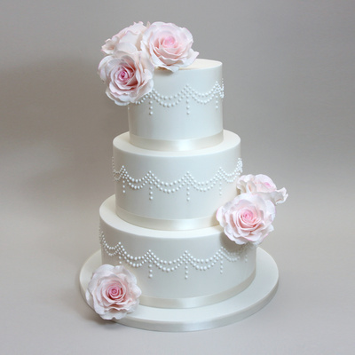 Piped drape cake with roses