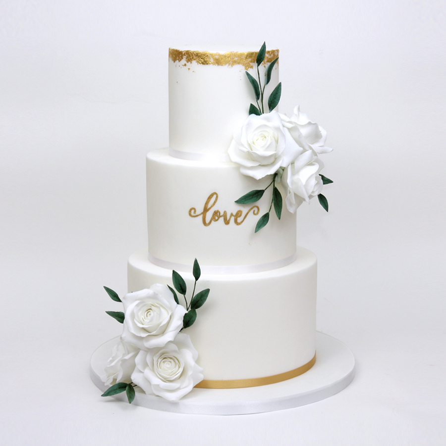 White roses and gold leaf cake