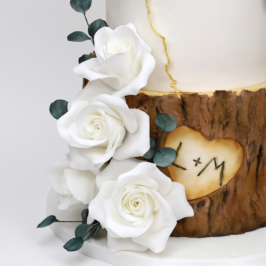 Woodland and white roses cake