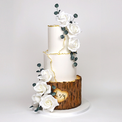 Woodland and white roses cake